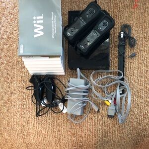 Working Used Nintendo Wii rvl101 Black Console, with Accessories and game discs.